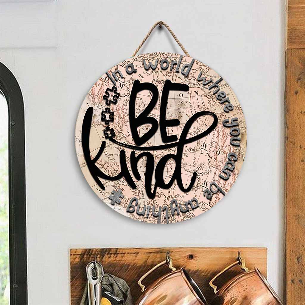 In einer Welt - Rundes Holzschild zur Sensibilisierung für Autismus