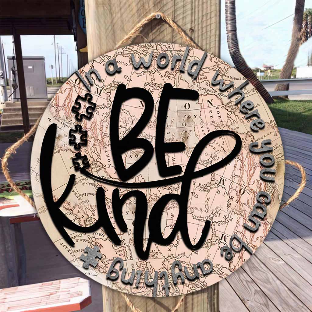 In einer Welt - Rundes Holzschild zur Sensibilisierung für Autismus